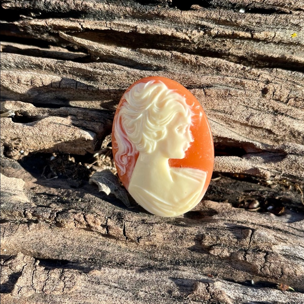 1960's White Cameo on Peach Background